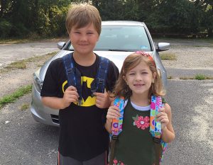 Young patient returns from school after treatment