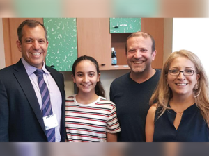 Eliya and her family with Michael Vitale, MD